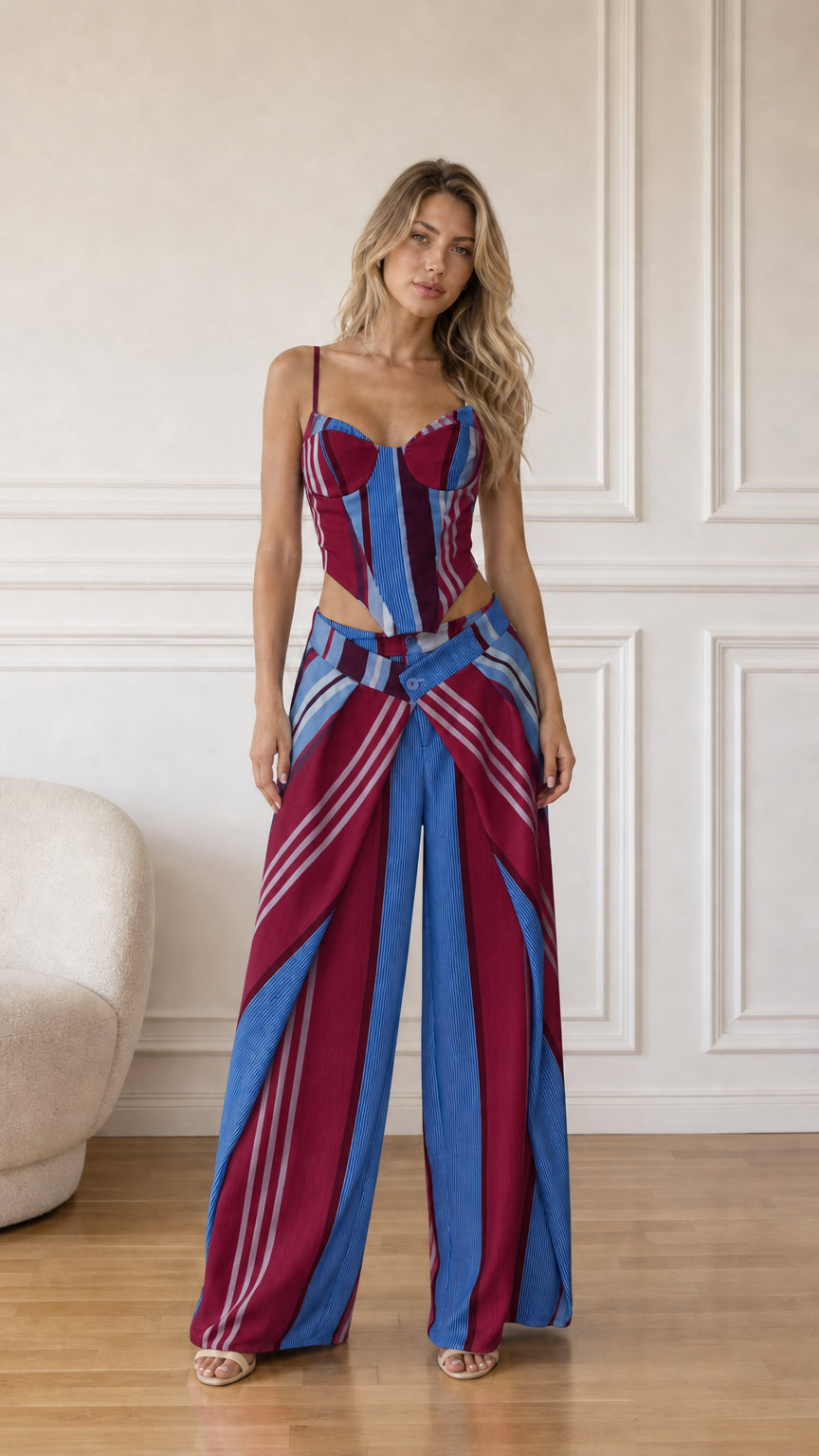 Model wearing burgundy multi striped corset top and wide-leg pants
