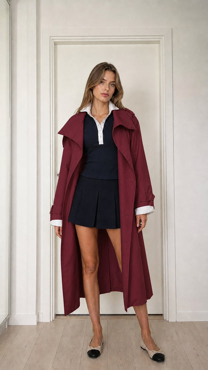 Front full-length view of model wearing burgundy red long trench coat