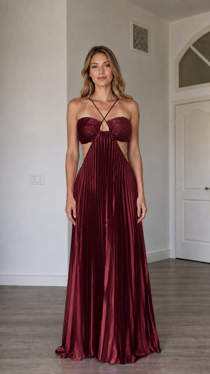 Front view of model wearing the burgundy metallic pleated halter maxi dress