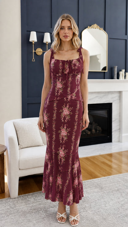 Front view of woman wearing burgundy floral midi dress