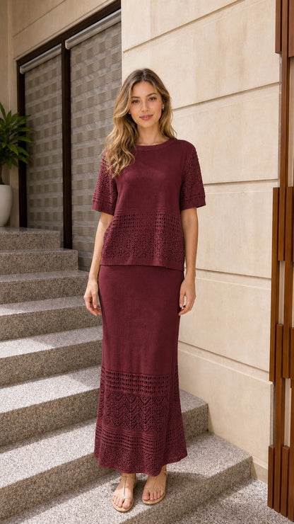 Front view of woman wearing burgundy wine knit two-piece top and maxi skirt set