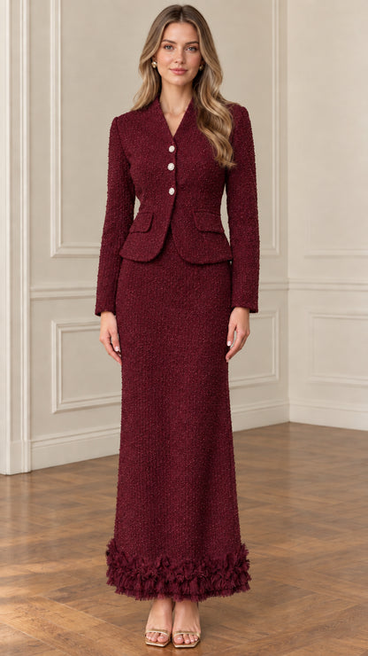 Front view of model wearing burgundy red tweed blazer and maxi skirt two-piece set
