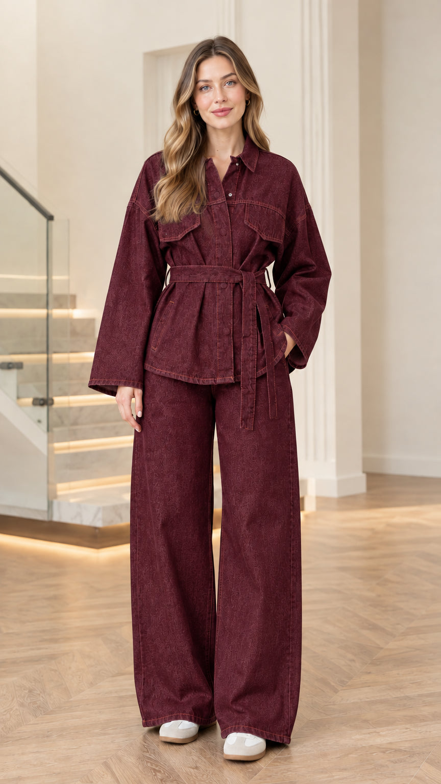 Model wearing burgundy wine red denim belted jacket and wide-leg pants set