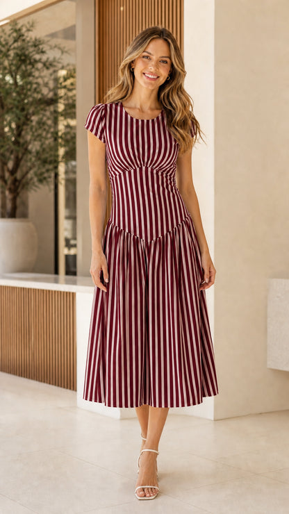Woman wearing burgundy striped midi dress