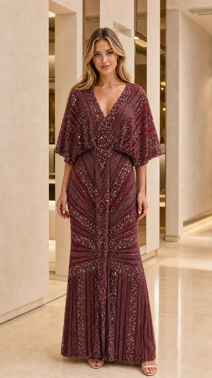 Full length view of woman in burgundy embellished evening gown
