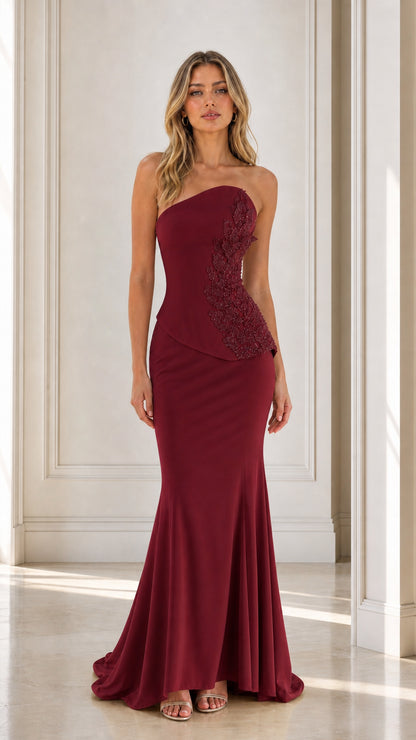 Front view of burgundy strapless beaded mermaid evening dress