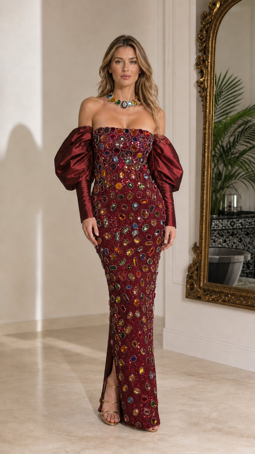 Full-length view of burgundy red crystal embellished evening gown with matching red puff sleeves