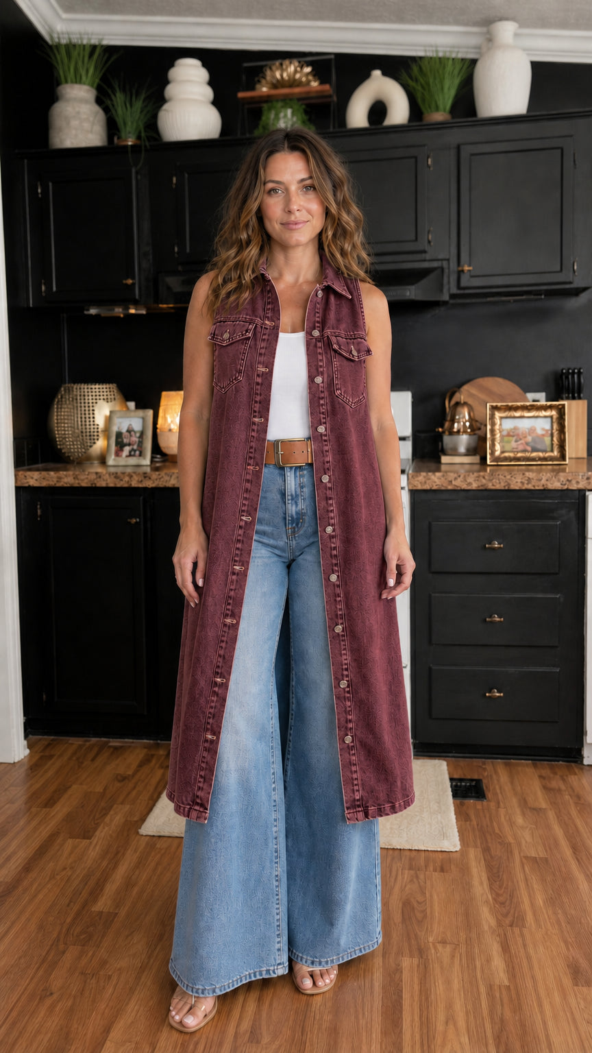 Woman wearing burgundy longline denim vest over white top