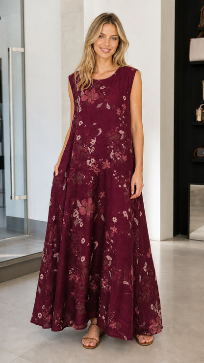 Model wearing burgundy floral sleeveless maxi dress