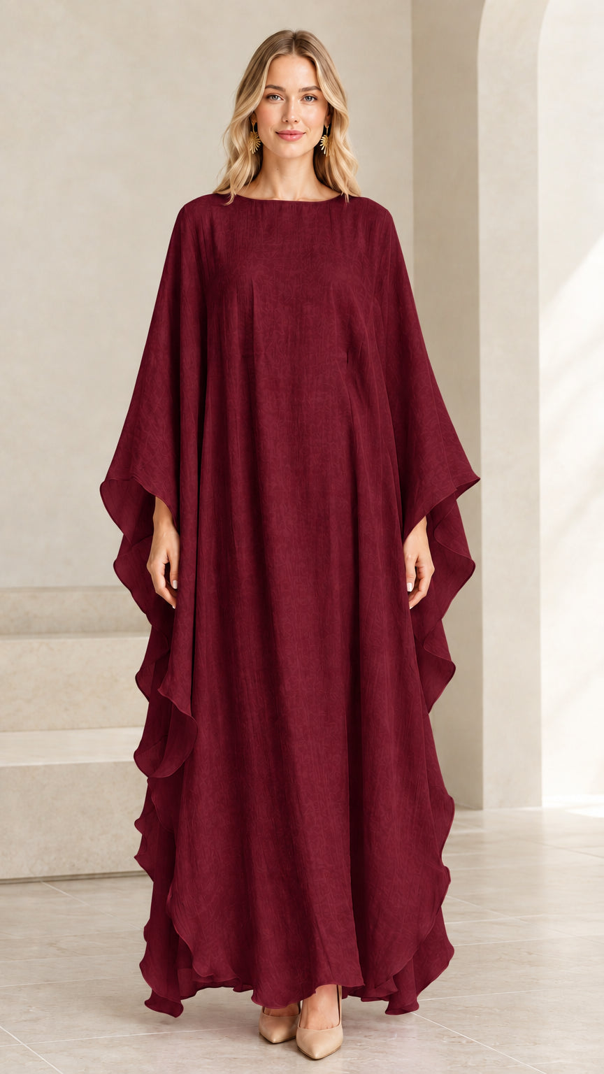 Model wearing burgundy wine red cascading ruffle kaftan dress