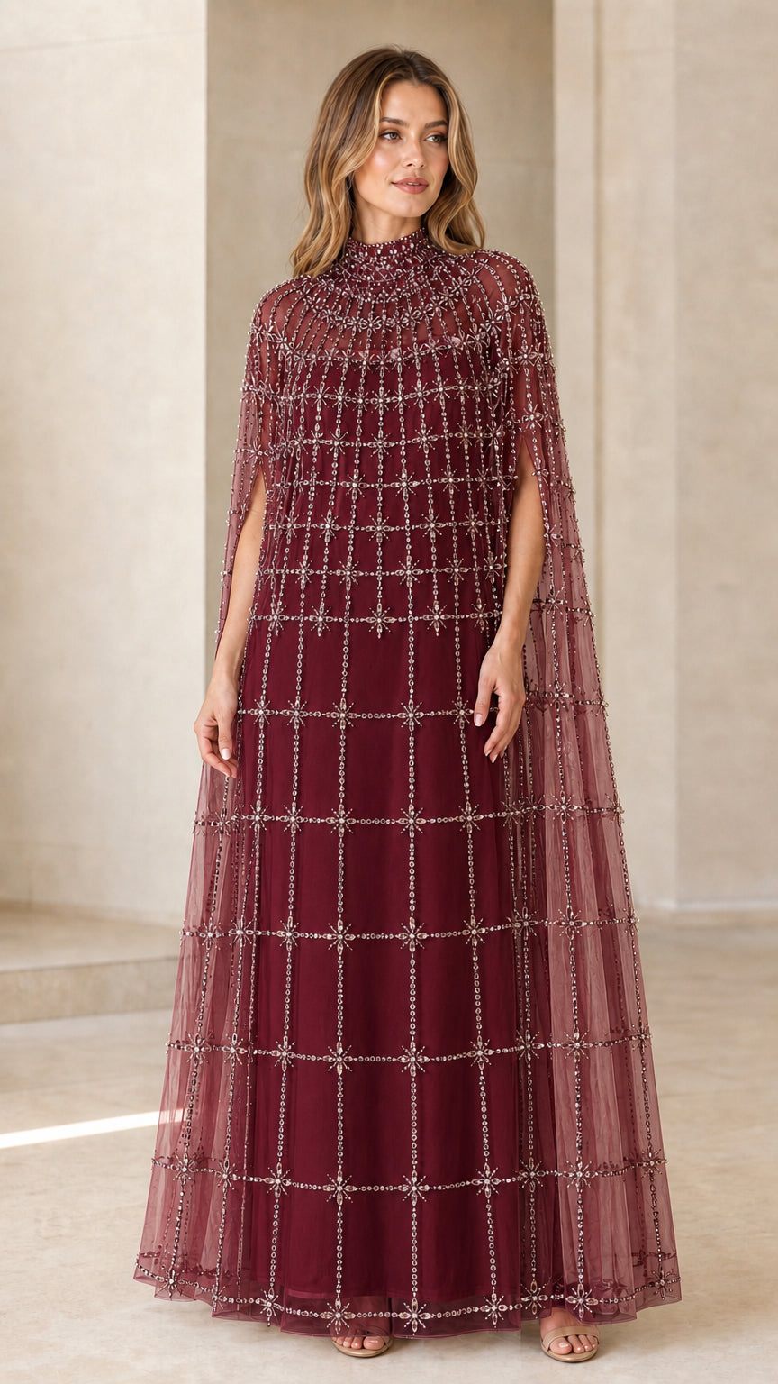 Front view of model wearing Burgundy wine beaded cape evening gown