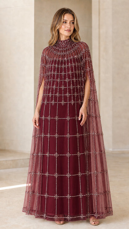 Front view of model wearing Burgundy wine beaded cape evening gown