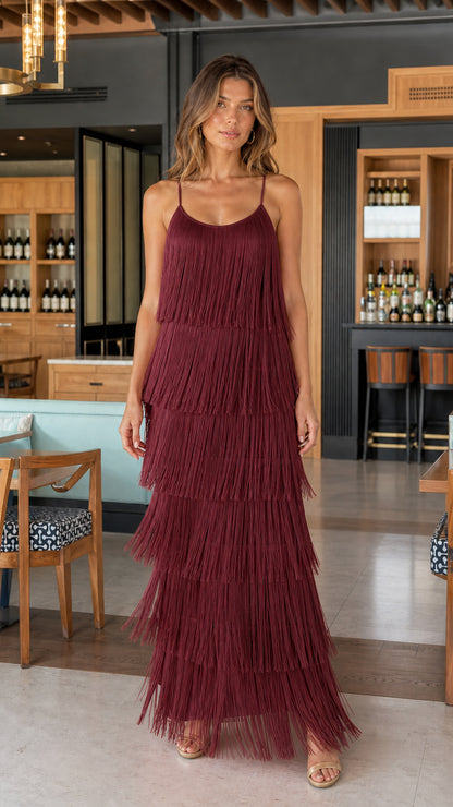 Model wearing burgundy tiered fringe maxi dress