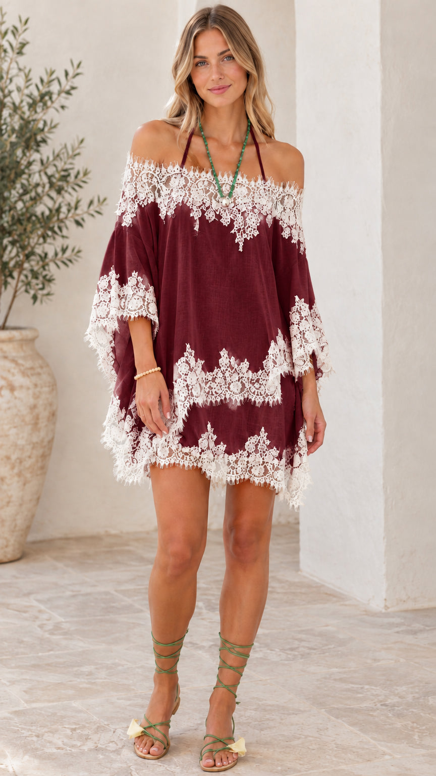 Model wearing Burgundy red off-the-shoulder lace tunic mini dress
