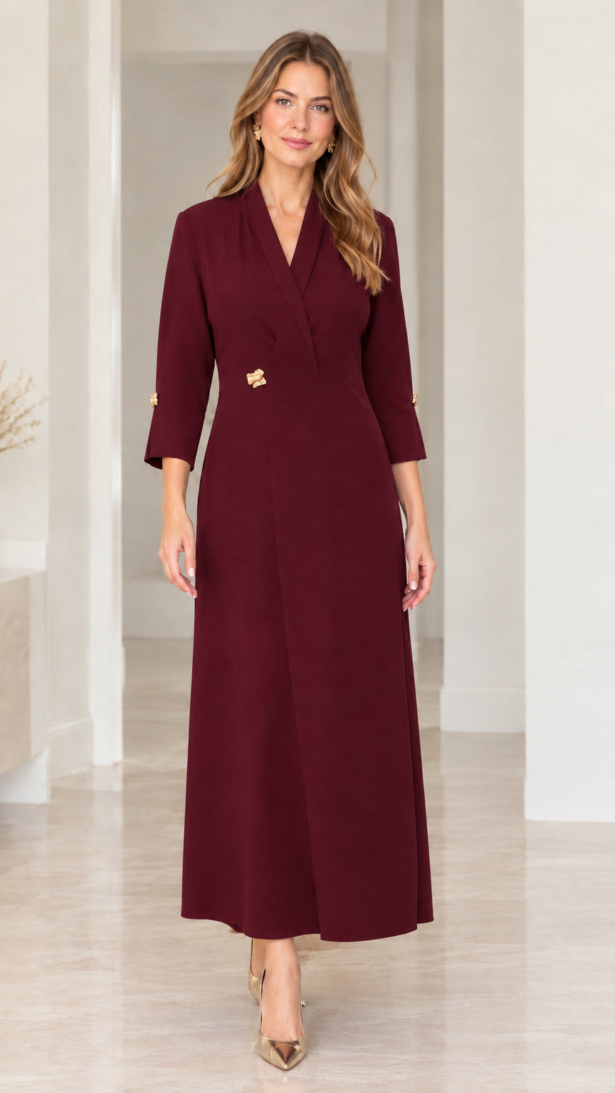 Front full-length view of woman in rich burgundy lapel V-neck maxi dress