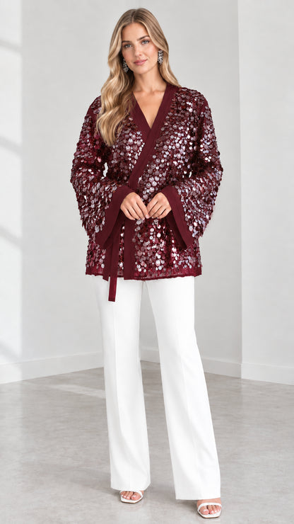 Model wearing Burgundy wine sequin kimono wrap jacket with belted waist