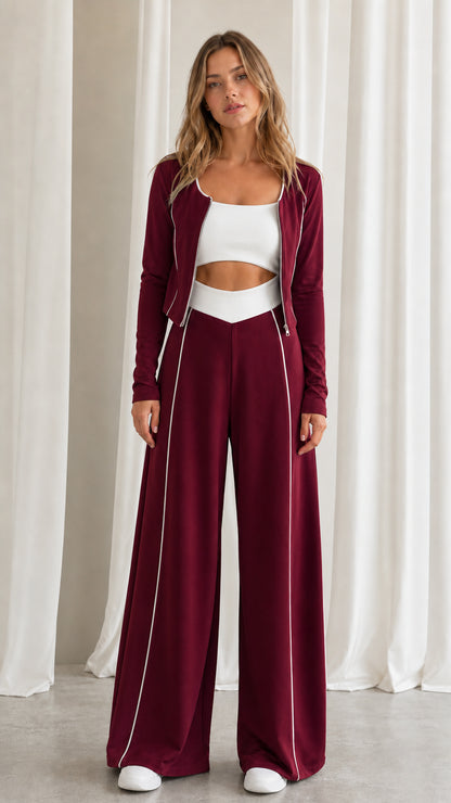 Front view of women's burgundy red 2-piece tracksuit set with contrast white piping