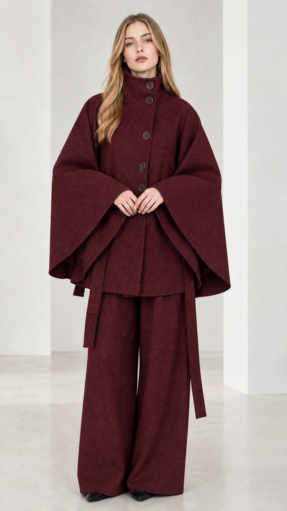 Front view of burgundy wine high neck belted cape coat and wide-leg trousers set
