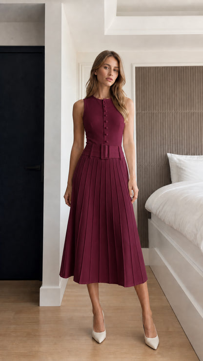 Front view of model wearing burgundy sleeveless pleated belted midi dress
