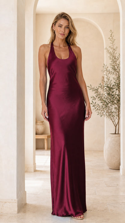 Front view of woman wearing burgundy satin scoop neck maxi dress