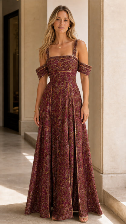 Model wearing rich burgundy wine embroidered cold-shoulder formal gown