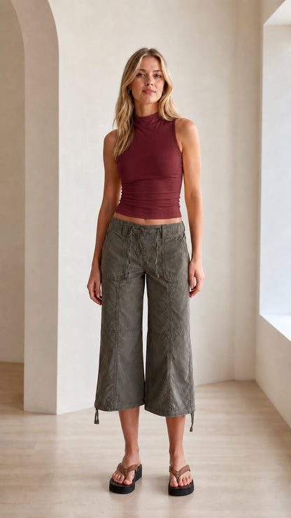 Model wearing burgundy red fitted mock neck sleeveless tank top