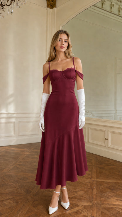 Full-length view of burgundy red cold-shoulder bustier satin midi dress