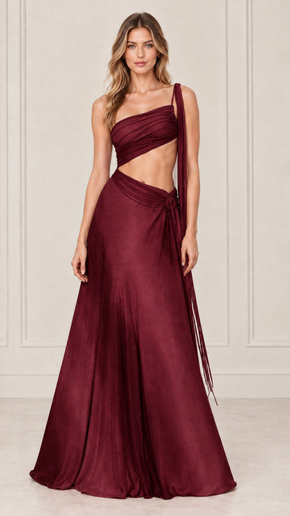 Front view of model wearing burgundy wine one-shoulder cutout evening gown
