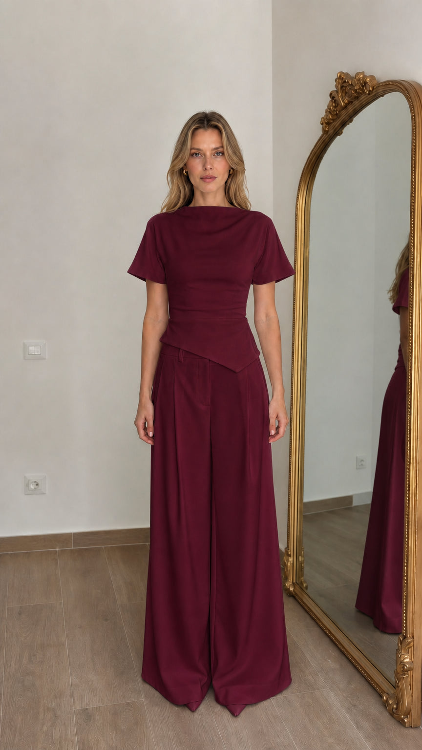 Front view of woman wearing burgundy matching top and wide-leg pants