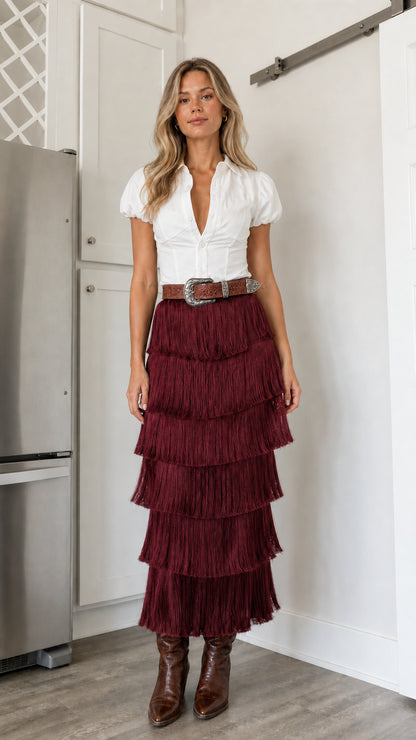 Front view of burgundy tiered fringe midi skirt