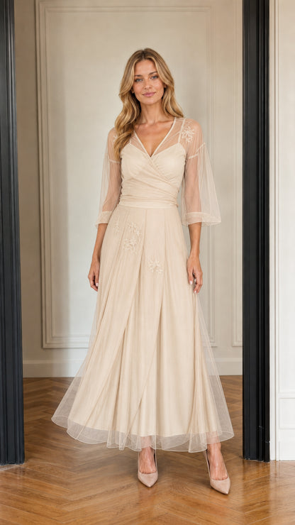 Model wearing champagne beige embroidered tulle formal dress
