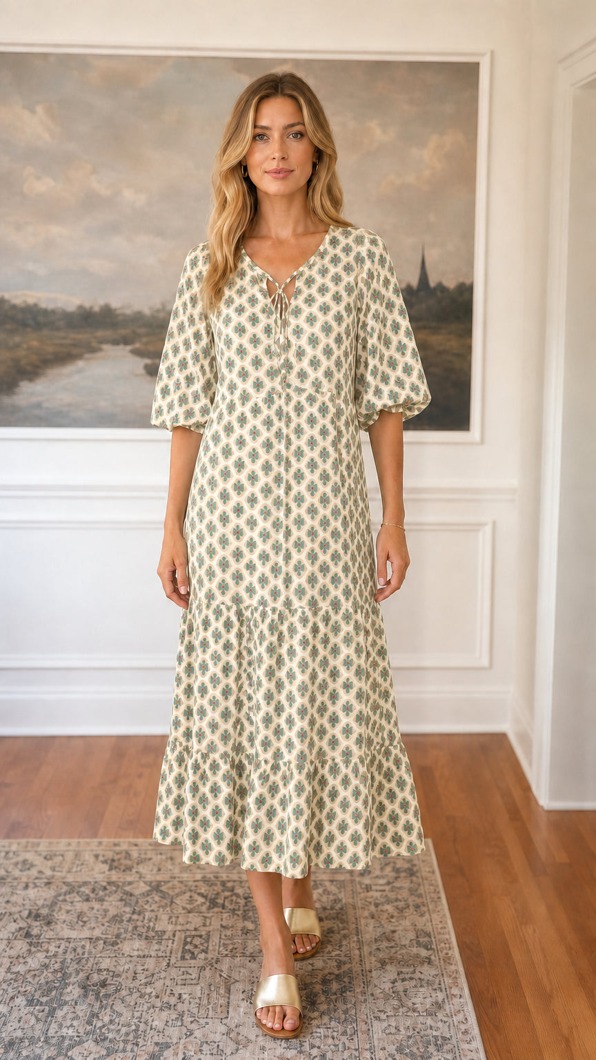 Front view of beige floral tiered midi dress