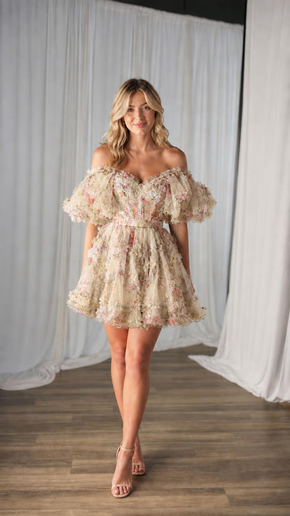 Model wearing champagne floral tulle mini dress