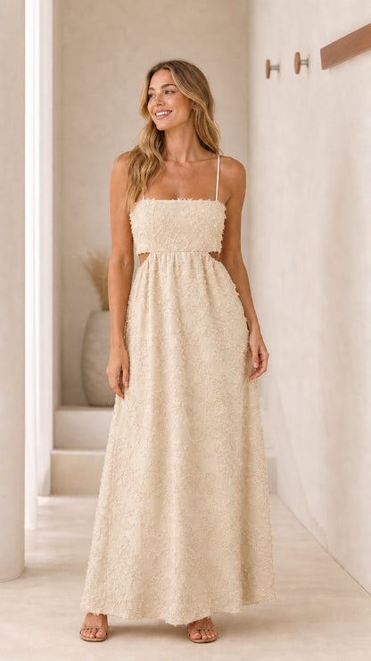 Front view of cream textured cutout maxi dress