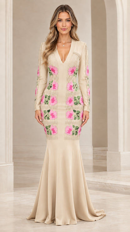 Front view of champagne beige long sleeve floral applique mermaid evening gown