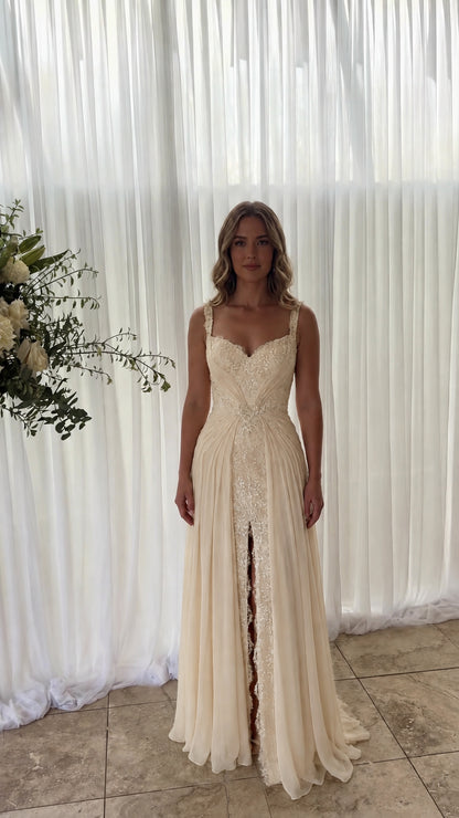 Front view of model wearing champagne cream lace inset chiffon maxi dress