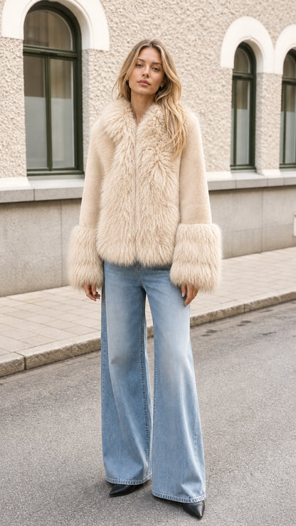 Model wearing cream ivory faux fur trimmed short jacket with jeans