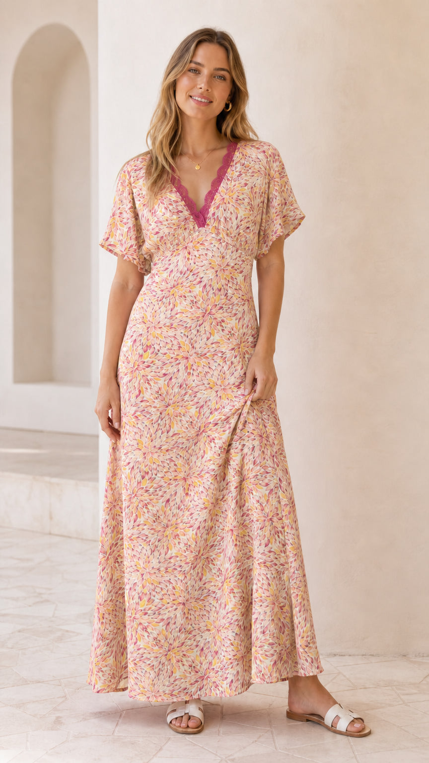 Front view of model wearing blush pink floral lace trim maxi dress
