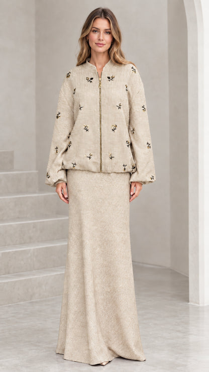 Full-length view of beige champagne beaded tweed jacket and maxi skirt set