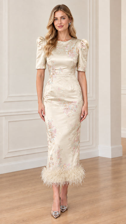 Front view of Champagne ivory floral jacquard midi dress with feather hem