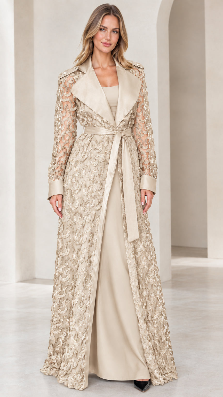 Model wearing champagne beige floral lace maxi overcoat with satin trim