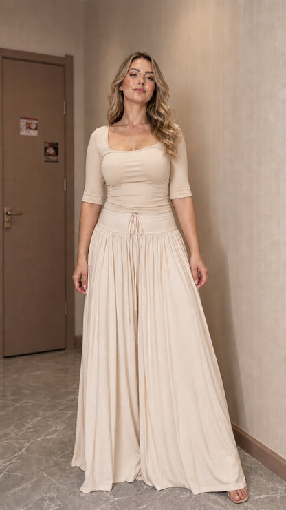 Front view of woman wearing beige matching two-piece set