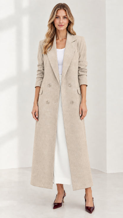 Front full-length view of woman wearing neutral beige maxi double-breasted coat