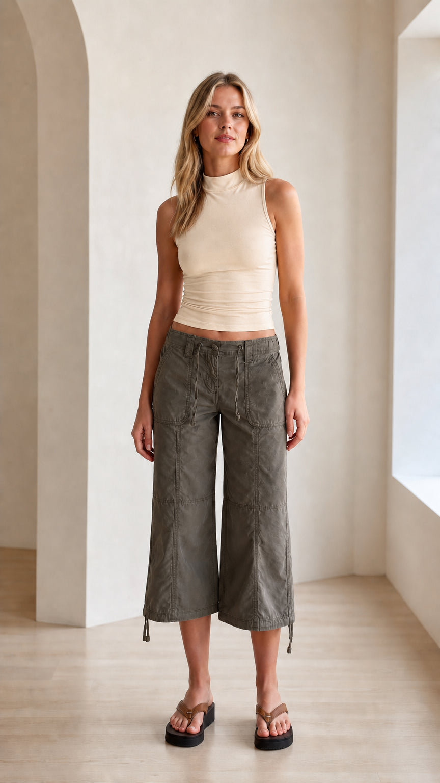 Model wearing cream off-white fitted mock neck sleeveless tank top