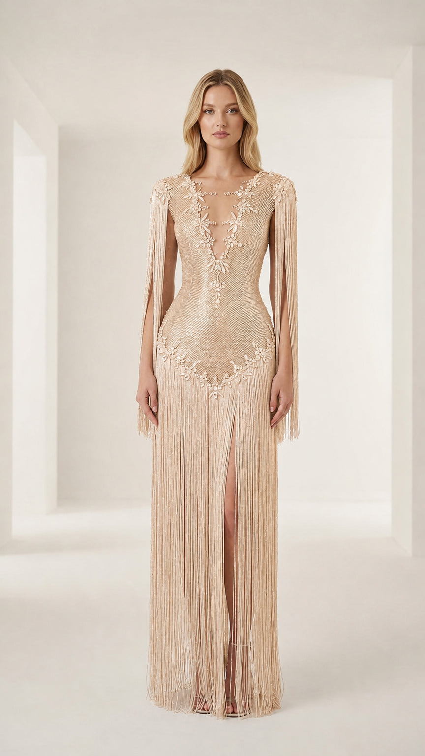 Front view of model wearing a champagne crystal-embellished fringe evening gown