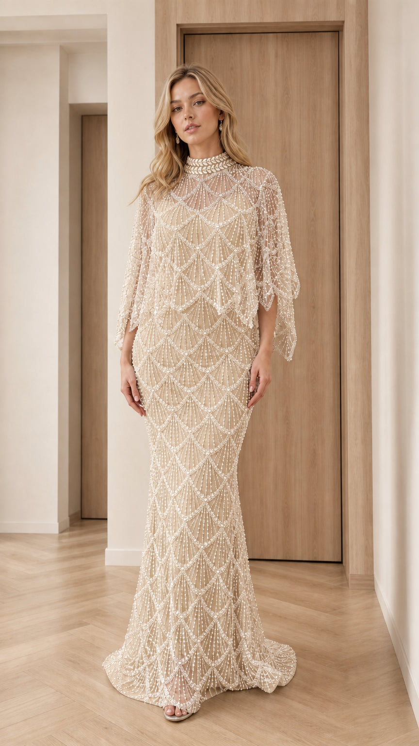 Front view of champagne gold pearl-embellished capelet evening gown