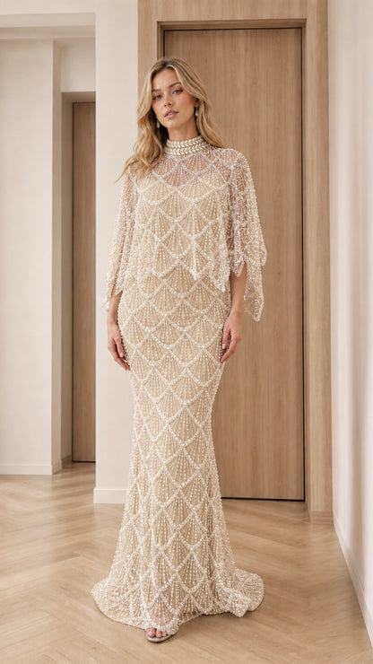 Front view of champagne gold pearl-embellished capelet evening gown