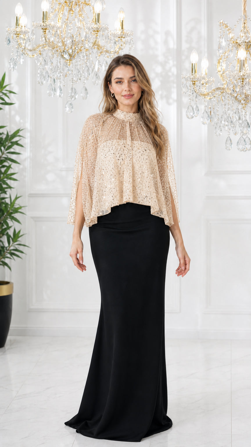 Model wearing champagne sequin capelet with black maxi formal dress