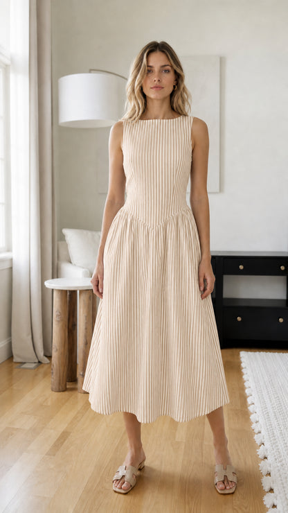 Front view of woman wearing beige striped midi dress