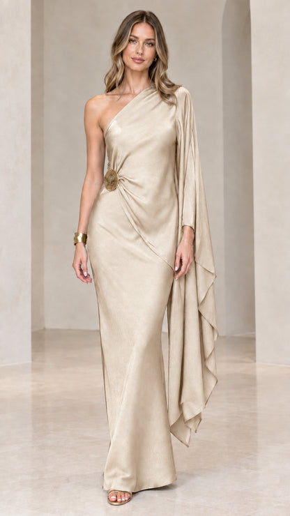 Champagne gold one-shoulder draped satin evening gown with cape sleeve